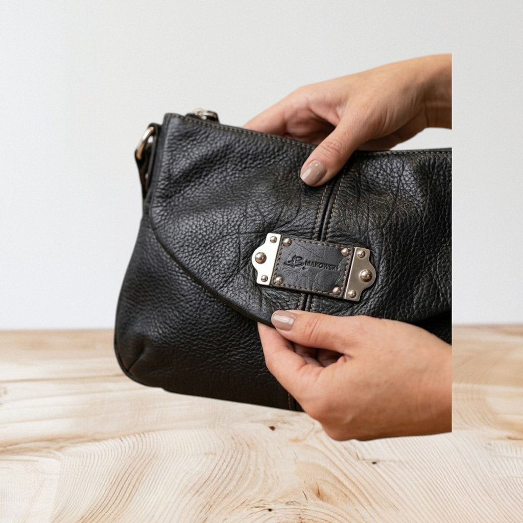 Marcia's Chic Boutique black faux leather hobo bag with crocodile texture and silver hardware.