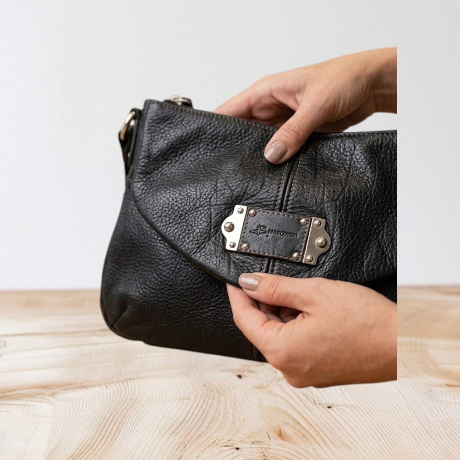 Marcia's Chic Boutique black faux leather hobo bag with crocodile texture and silver hardware.