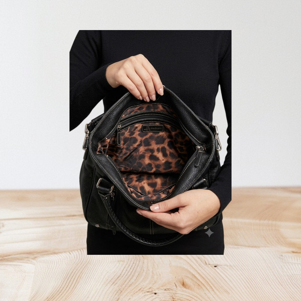 Marcia's Chic Boutique black faux leather hobo bag with embossed crocodile texture and leopard print lining.